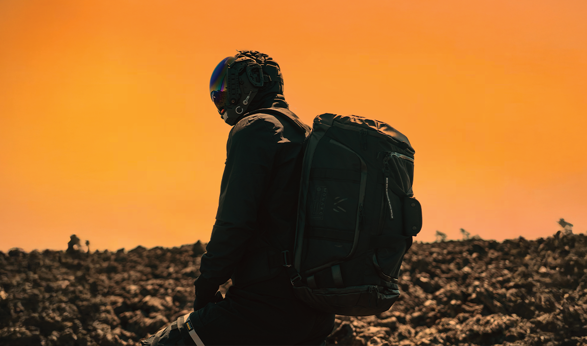 MONARC operator with Duffel Backpack at sunset
